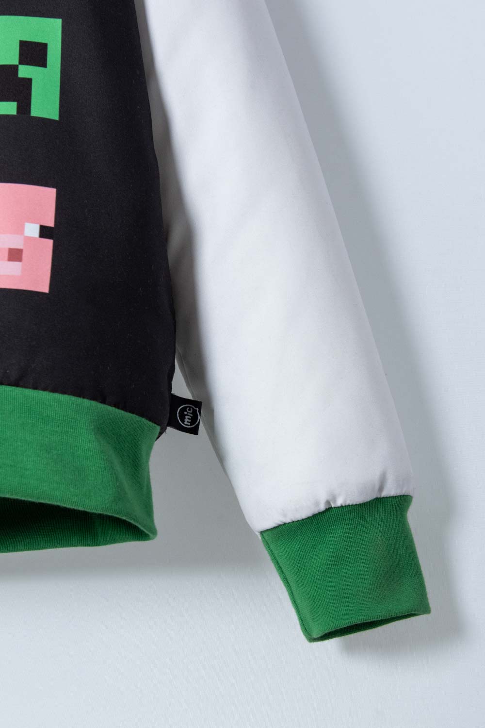 CHAQUETA DE MINECRAFT MARFIL Y NEGRA ESTAMPADA EN FRENTE PARA NIÑO